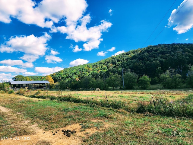 mountain view featuring a rural view