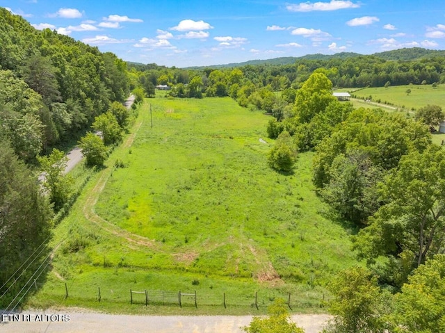 birds eye view of property with a rural view