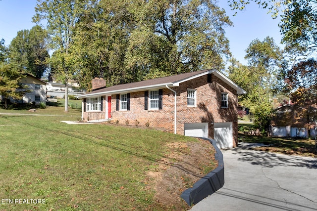 ranch-style home with a garage and a front lawn