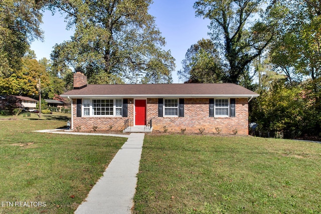 ranch-style home with a front yard