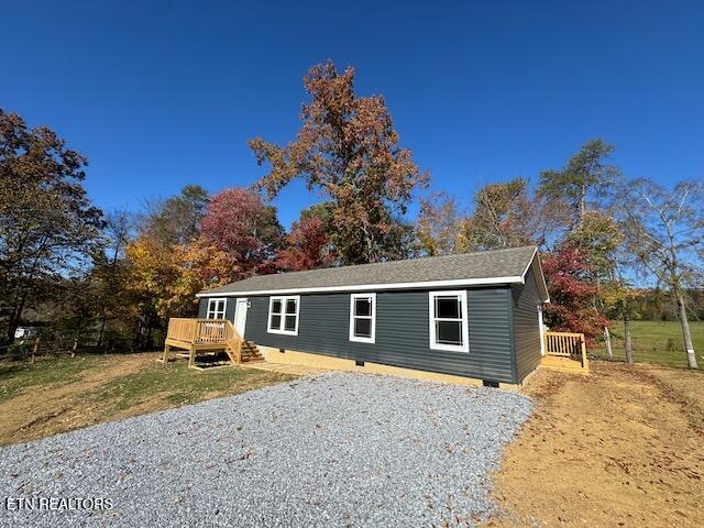 view of front of property featuring a wooden deck