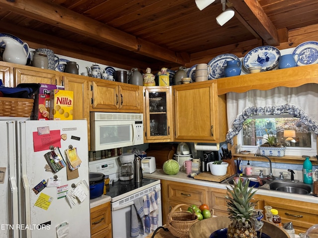 kitchen with wood ceiling, sink, white appliances, and beamed ceiling