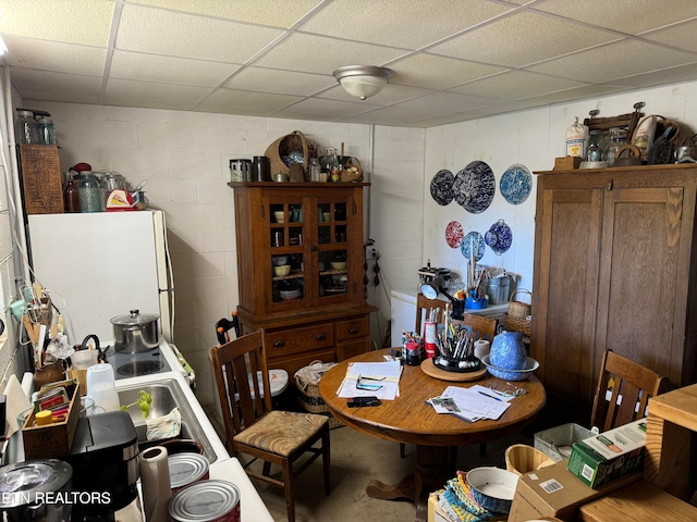 dining room with a drop ceiling