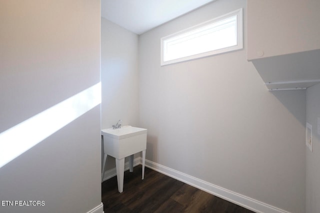 washroom with dark wood-type flooring