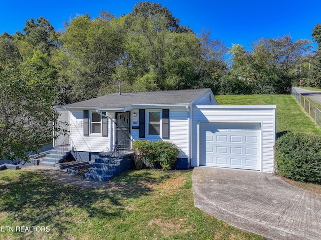 ranch-style house with a front lawn and a garage