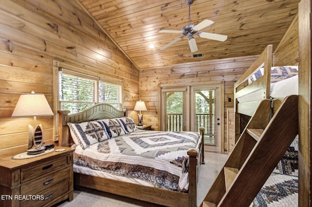 bedroom with lofted ceiling, multiple windows, wooden ceiling, and access to exterior