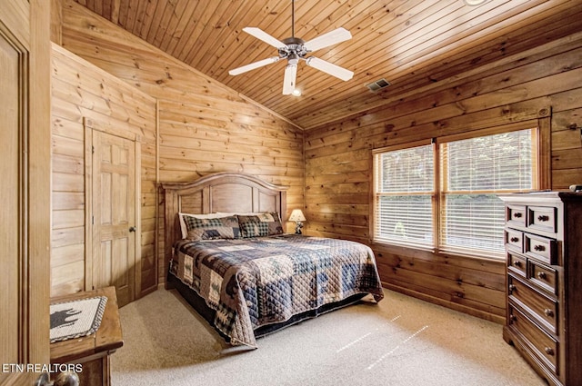 bedroom with lofted ceiling, wooden walls, wooden ceiling, light colored carpet, and ceiling fan