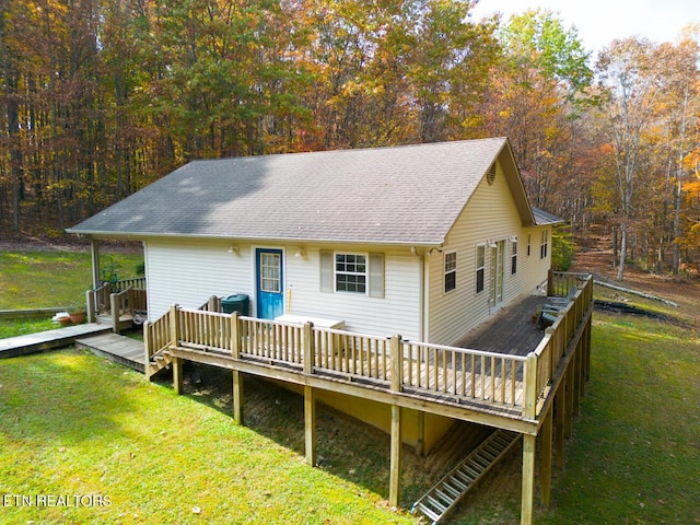 1149 Panther Branch Rd, Jamestown, TN 38556 - back of house with a wooden deck, a lawn, a shingled roof, and a forest view