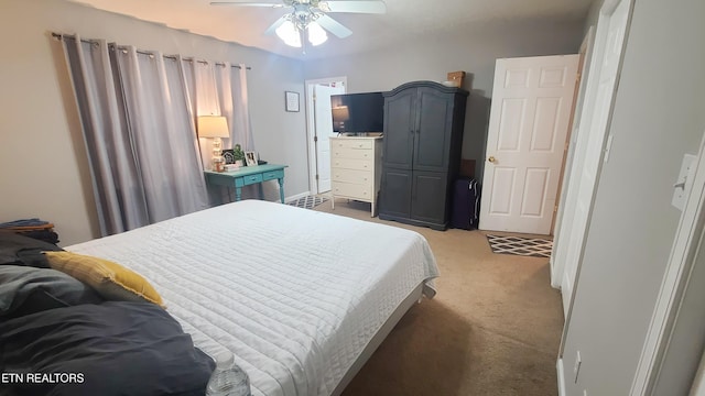 bedroom featuring ceiling fan and carpet