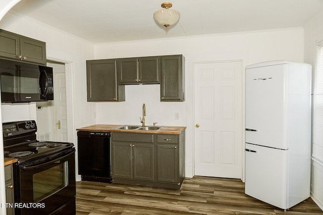 kitchen featuring wood counters, sink, black appliances, and dark hardwood / wood-style flooring