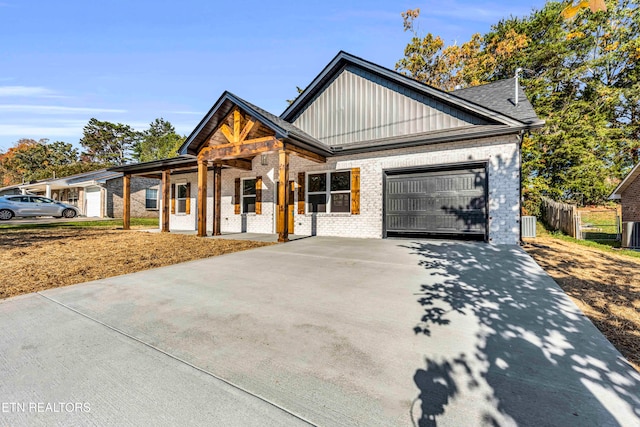 view of front of home featuring a garage and central AC unit