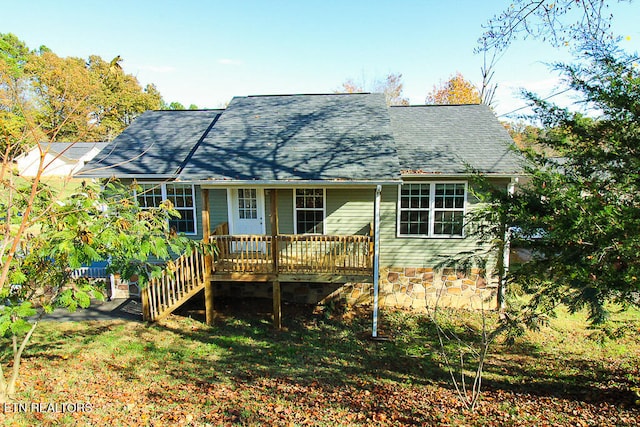 back of property featuring a wooden deck