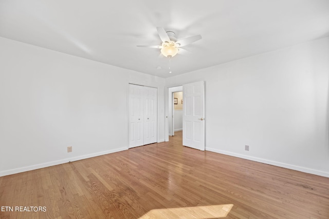 spare room featuring light hardwood / wood-style floors and ceiling fan