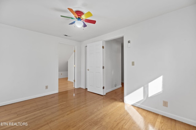 empty room with light hardwood / wood-style floors and ceiling fan