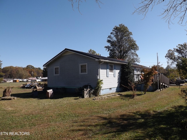 view of home's exterior featuring a yard