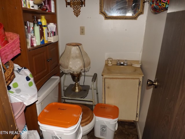 bathroom with toilet and vanity