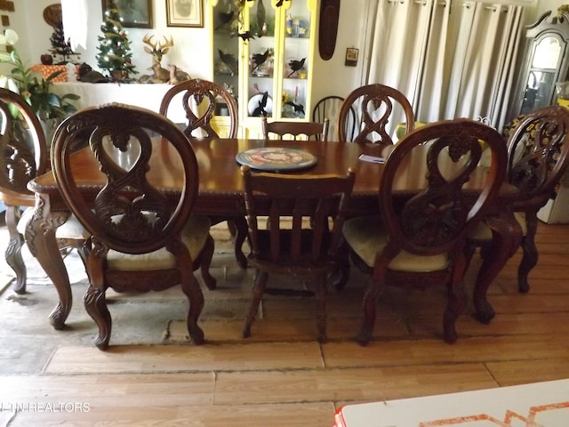 dining space with light wood-type flooring