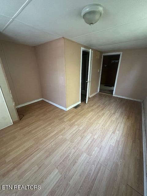 unfurnished room featuring light wood-type flooring