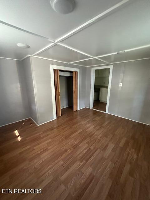 interior space with dark hardwood / wood-style flooring