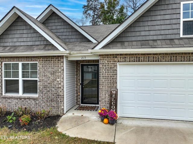 view of exterior entry featuring a garage