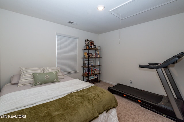 bedroom featuring light carpet