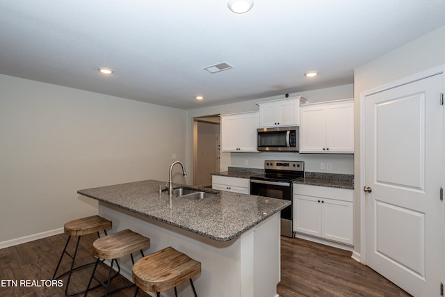 kitchen featuring sink, appliances with stainless steel finishes, dark hardwood / wood-style floors, and white cabinetry