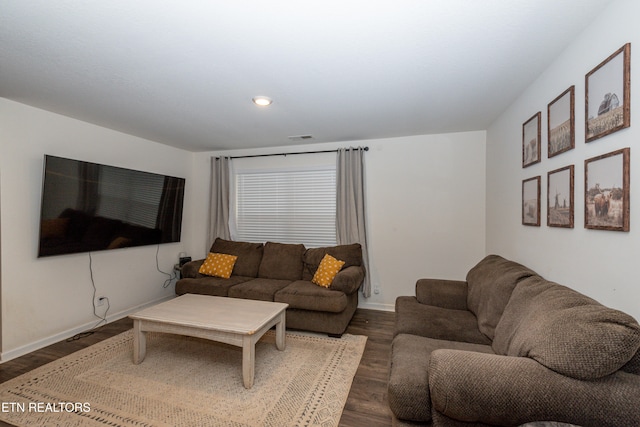 living room with dark hardwood / wood-style flooring