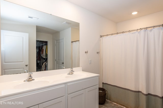 bathroom with vanity and walk in shower