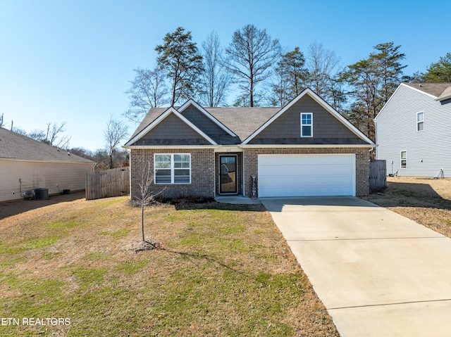 view of front of property featuring a garage, brick siding, fence, concrete driveway, and a front lawn