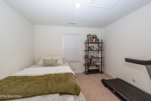 bedroom featuring attic access, carpet, visible vents, and baseboards