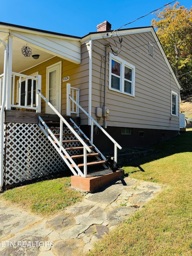 view of property exterior featuring a lawn