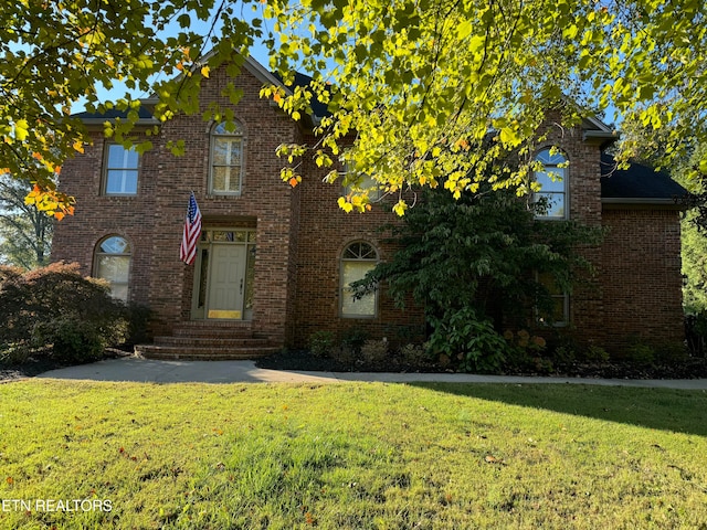 front facade with a front yard