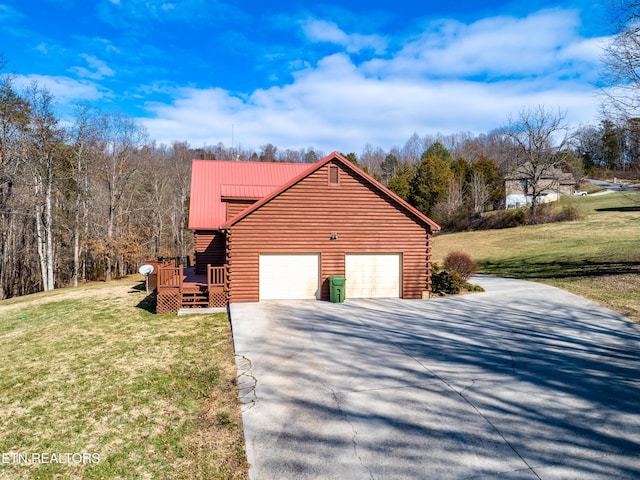 view of property exterior featuring a wooden deck, a garage, and a lawn