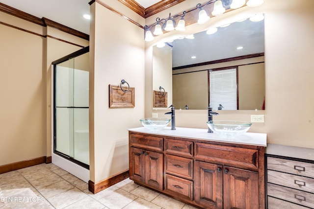 bathroom with ornamental molding, an enclosed shower, tile patterned flooring, and vanity