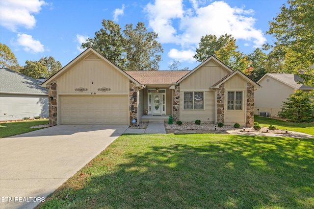 ranch-style home with a front yard and a garage