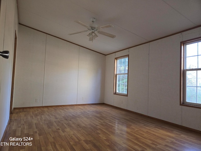 unfurnished room featuring hardwood / wood-style flooring and ceiling fan