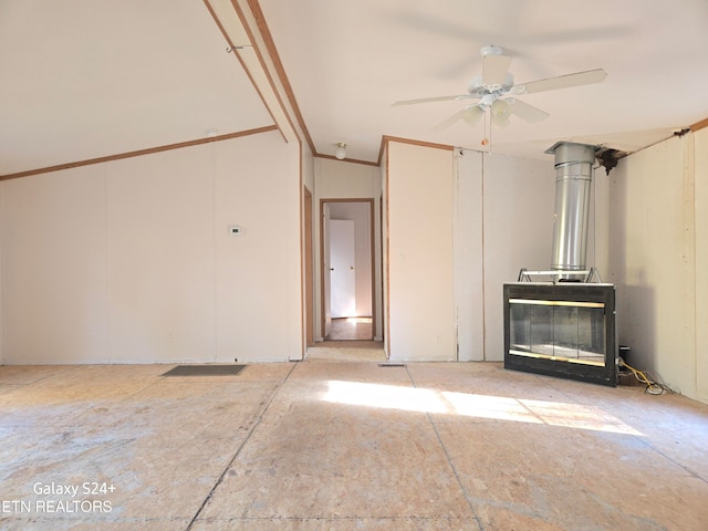 unfurnished living room with ceiling fan and lofted ceiling