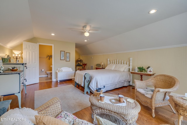 bedroom featuring lofted ceiling, hardwood / wood-style floors, ceiling fan, a spacious closet, and a closet