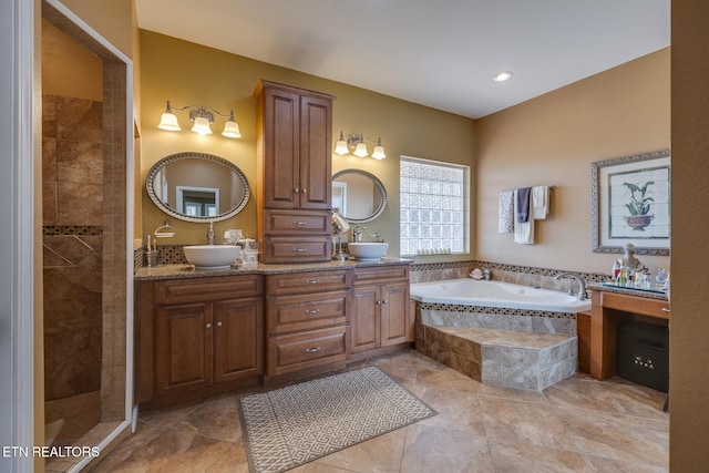 bathroom featuring vanity, independent shower and bath, and tile patterned flooring