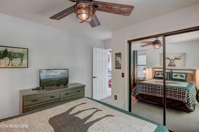 carpeted bedroom with a closet and ceiling fan