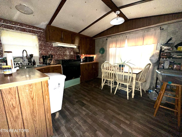 kitchen featuring kitchen peninsula, extractor fan, vaulted ceiling with beams, wood walls, and black appliances