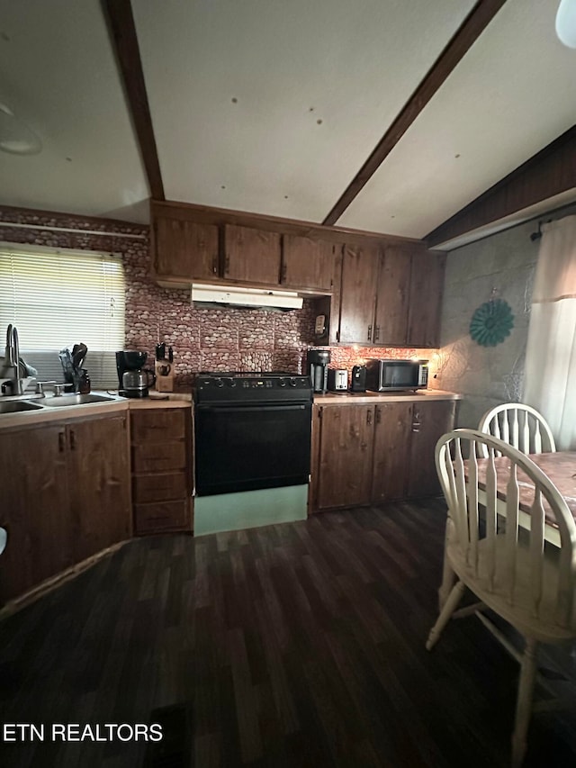 kitchen featuring sink, backsplash, range, lofted ceiling with beams, and dark hardwood / wood-style floors