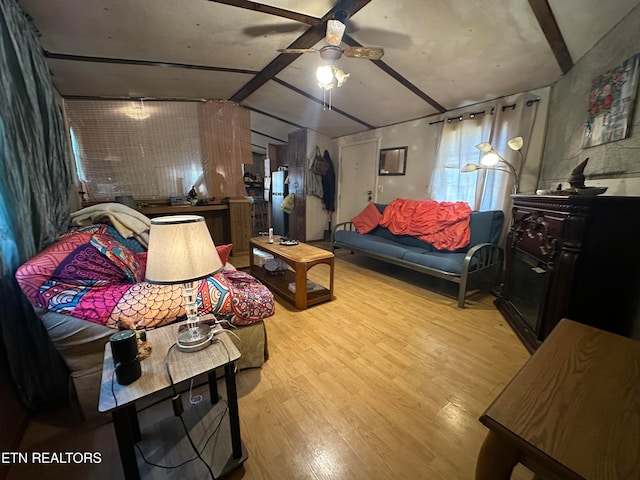 interior space featuring vaulted ceiling, light wood-type flooring, and ceiling fan