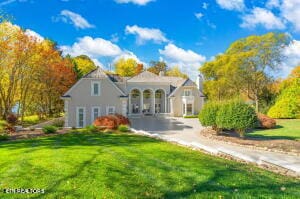 mediterranean / spanish-style home with a front lawn