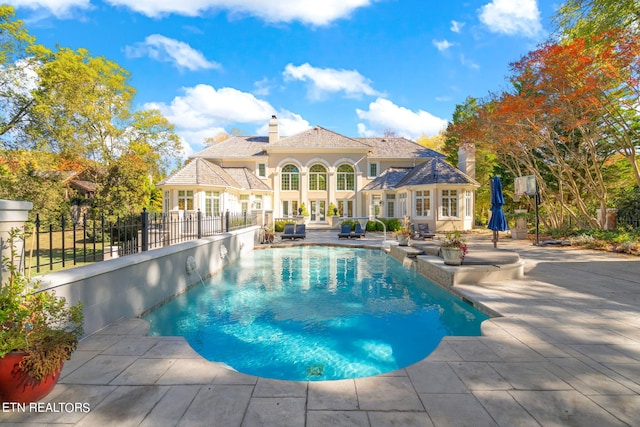 view of swimming pool featuring a patio area