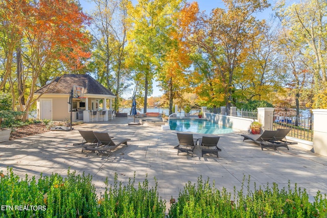 exterior space with a fenced in pool