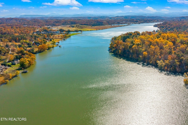 aerial view featuring a water and mountain view