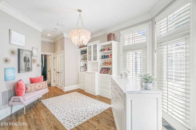 interior space with a chandelier and light wood-type flooring