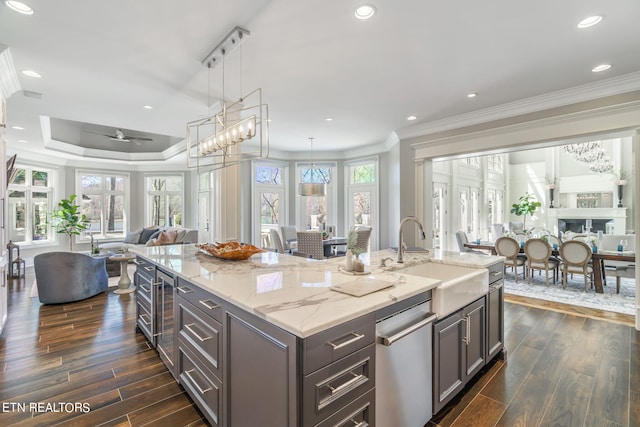 kitchen with dark hardwood / wood-style floors, sink, and plenty of natural light