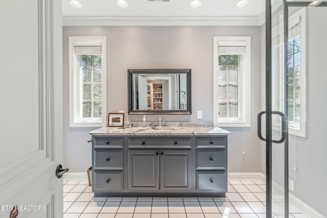 bathroom with vanity, crown molding, and tile patterned floors